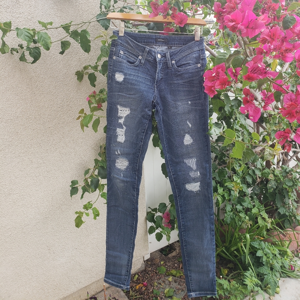 Bebe size 25 distressed reinforced jeans